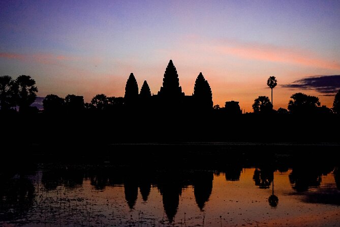 Angkor Sunrise Vespa Tour / Tuk Tuk or Car - Ta Prohm with tree roots: walking smart in shade and dust