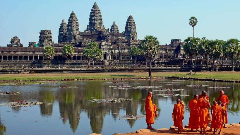 Angkor Wat: 2-Day Sunrise and Floating Village Tour - Angkor Thom South Gate, Bayon, and Baphoun: faces, gateways, and context