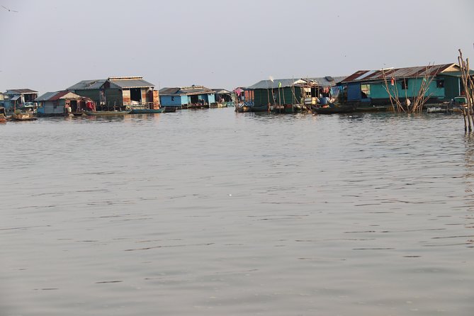 Guided Floating Village Boat Tour in Siem Reap - Boarding a long-tail cruise: where Tonle Sap homes actually make sense
