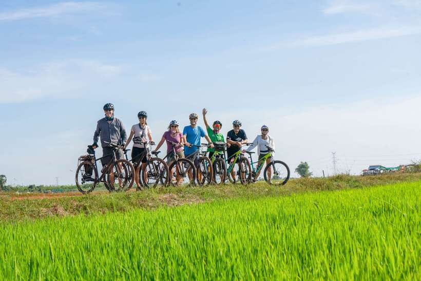 Kampong Phluk: Floating Village Sunset Bike Tour or E-Bike - Kampong Phluk: stilts, schools, a market, and village life from two angles