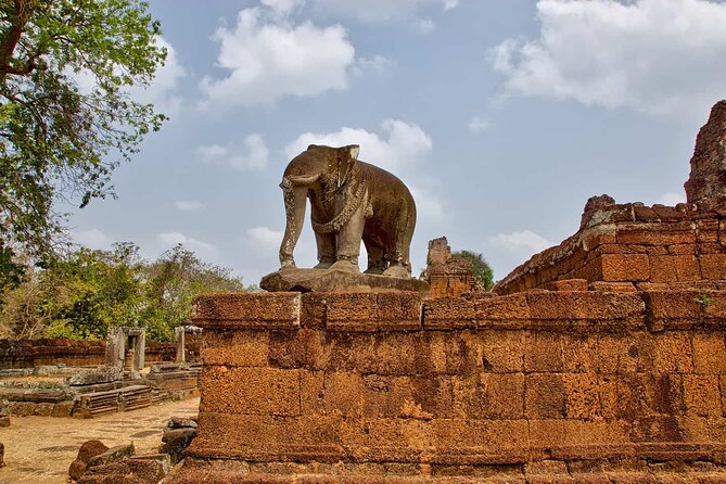 One Day Angkor World Heritage Tour - Bayon at Angkor Thom: grinning faces and a walled-city backdrop