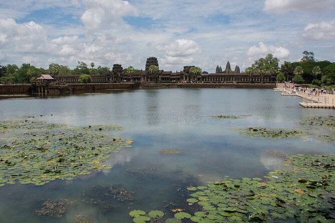 Private Sunrise Angkor Wat Tour with pickup from your hotel - Bayon Temple faces, plus a possible monk blessing