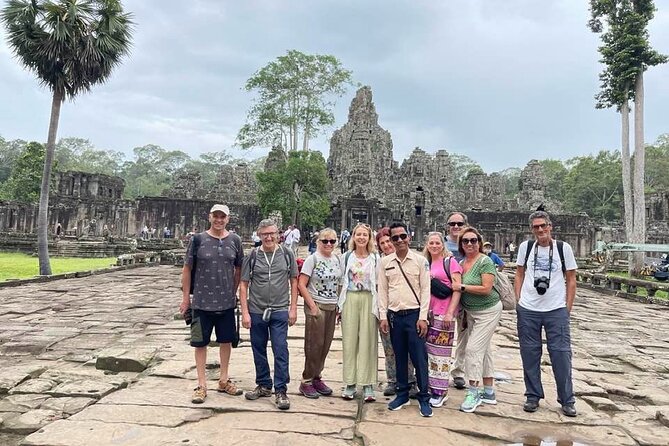 Sunrise Angkor Wat Temple Half Day Tour ( Small-Group Tour) - Bayon Temple: giant faces, mixed beliefs, and an evolving capital